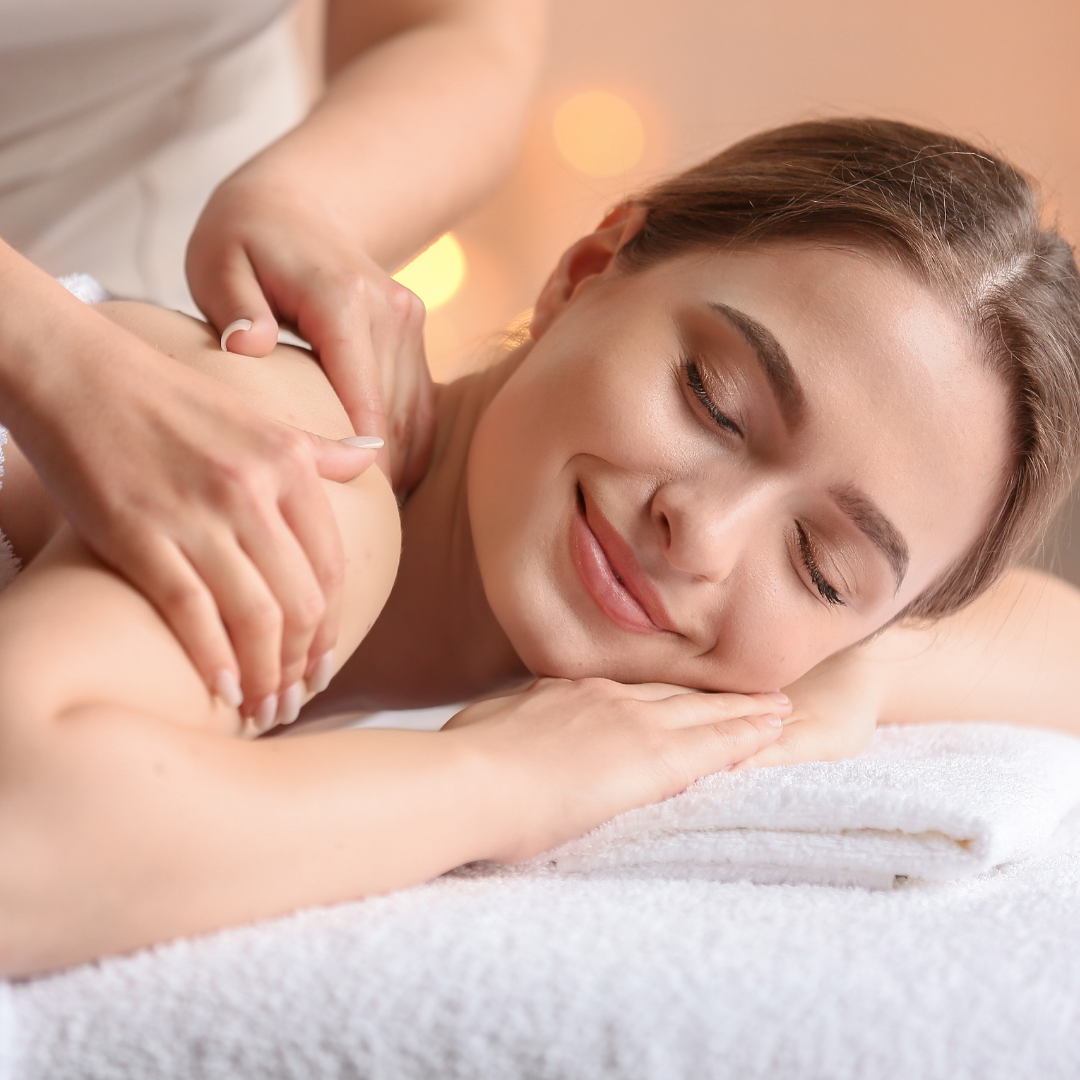 Close-up of a relaxation massage session, with a client enjoying a calming back massage in a serene spa setting