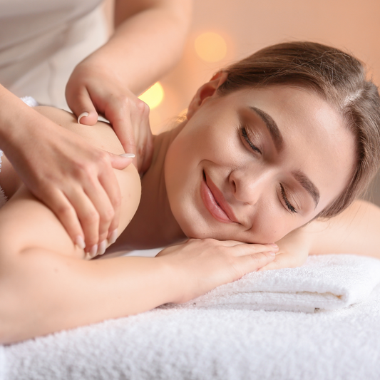 Close-up of a relaxation massage session, with a client enjoying a calming back massage in a serene spa setting